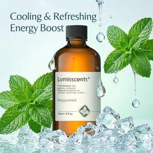 May include: A brown glass bottle of Lumisscents Peppermint Oil with a black cap, surrounded by fresh mint leaves, ice cubes, and water droplets. The label reads "Peppermint Oil" and "118ml / 4 fl.oz". The text "Cooling & Refreshing Energy Boost" is at the top.
