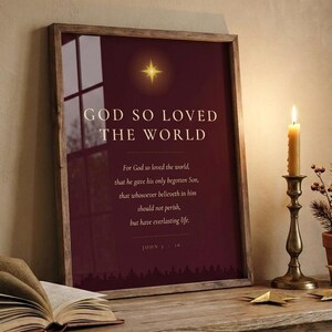 John 3:16 God So Loved on shelf, walnut frame, cozy christmas vignette with candle and pine, burgundy gold scripture print decor