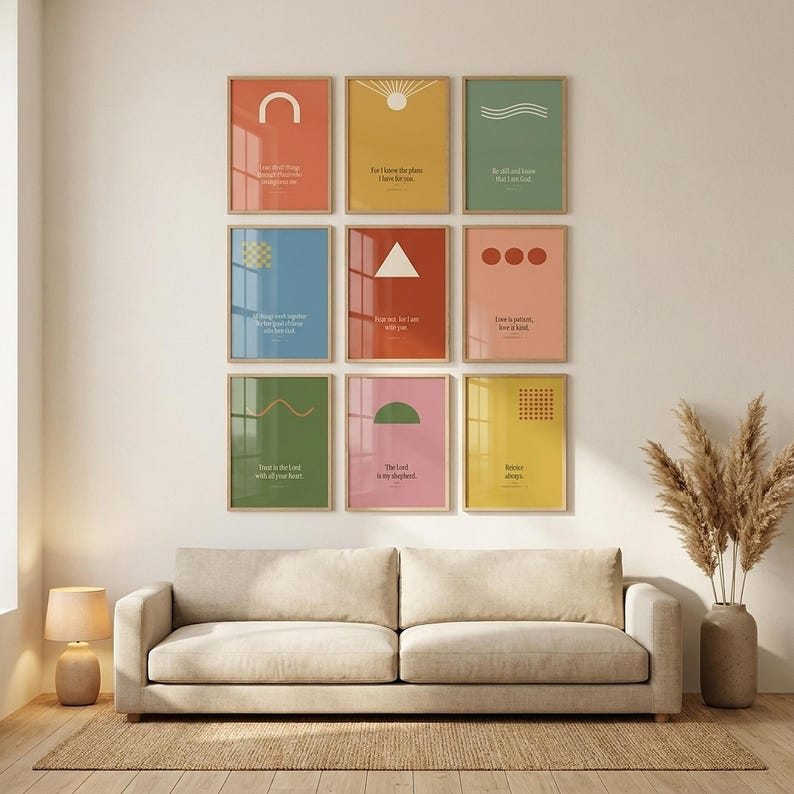 Trendy christian wall art set of 9 as photorealistic colorful gallery wall above beige linen sofa in modern scandinavian living room. Nine retro-maximalist bible verse prints with Philippians 4:13, Jeremiah 29:11, Psalm 46:10, Romans 8:28, Isaiah 41: