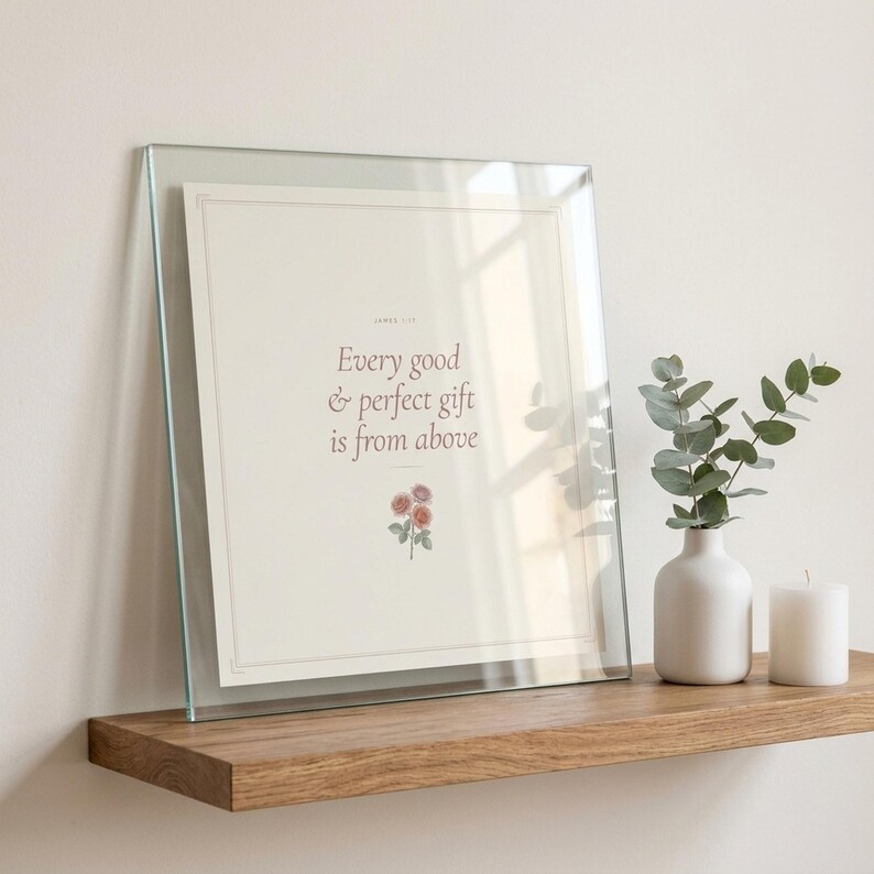 Every Good and Perfect Gift James 1 17 Wall Art Coquette Christian Print Blush B — room setting mockup in cozy living space with complementary decor. This coquette bow, botanical, pink blush christian scripture wall art print features beautiful serif typography on warm cream background. James 1 17 bible verse digital download printable for home office bedroom living room gallery wall decor. Per...