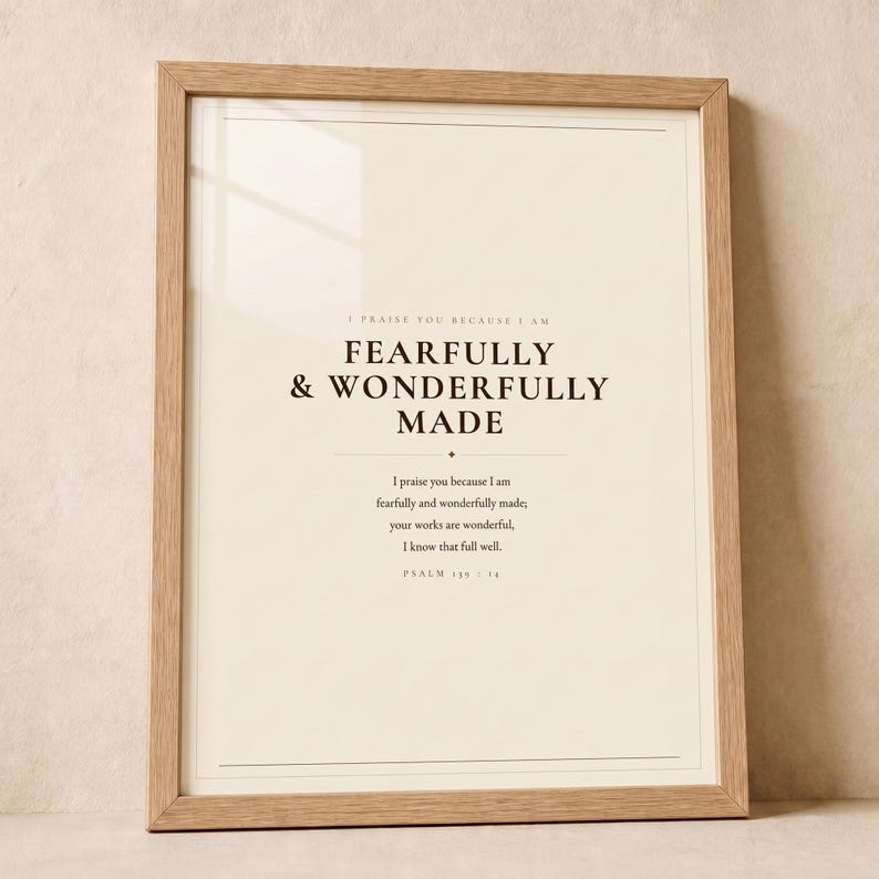 Hero view of the framed design, clearly showing the verse lettering, balanced spacing, and refined color palette. The Fearfully and Wonderfully Made artwork uses minimalist boho typography in beige, brown, and black. This Psalm 139:14 print suits a nursery, baptism gift, baby dedication, bedroom, or quiet Christian reading corner as printable digital wall art.