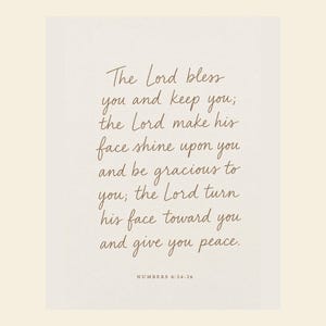 Close view of The Lord Bless You and Keep You nursery print featuring the Aaronic Blessing from Numbers 6:24-26. This gentle Christian wall art is the anchor of the Set of 4 and brings a timeless prayer of blessing, grace, and peace to a baby girl, baby boy, or gender-neutral nursery, baptism celebration, or baby dedication gift.