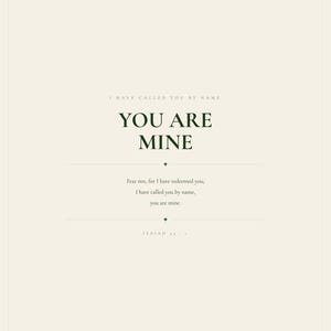 Hero view of the framed design, clearly showing the verse lettering, balanced spacing, and refined color palette. The You Are Mine artwork features Isaiah 43:1 in minimalist forest green typography on warm beige. This Isaiah 43:1 print suits a nursery, baptism gift, baby dedication, bedroom, or calm Christian reading corner as printable digital wall art.