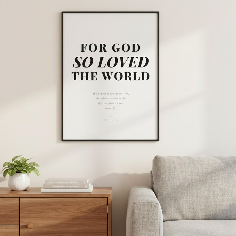 John 3 16 Wall Art For God So Loved the World Scripture Print Modern Christian, — "For God so loved the world that He gave His one and only Son", in contemporary bold serif typography in black on clean white background, displayed in a beautifully styled modern living room above a warm wooden sideboard with soft natural light creating gentle shadows on the frame