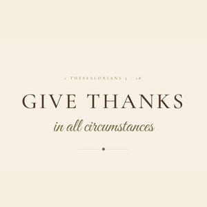 Close-up of the Give Thanks in All Circumstances typography, showing crisp dark brown display serifs and flowing olive script against a warm cream background. The image highlights the restrained capital line, delicate hairline divider, small diamond detail, italic verse body, and ESV caption that give this 1 Thessalonians 5:18 print its refined, faith-centered character.