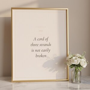 Christian Wedding Wall Art Set of 3 Bible Verse Prints Love Is Patient, in romantic wedding typography with elegant calligraphy, delicate gold ornamental accents on warm blush background, hanging above a cozy bed in a peaceful bedroom setting with soft linens and warm lighting, creating an inspiring and calming atmosphere perfect for morning devotions and evening prayer