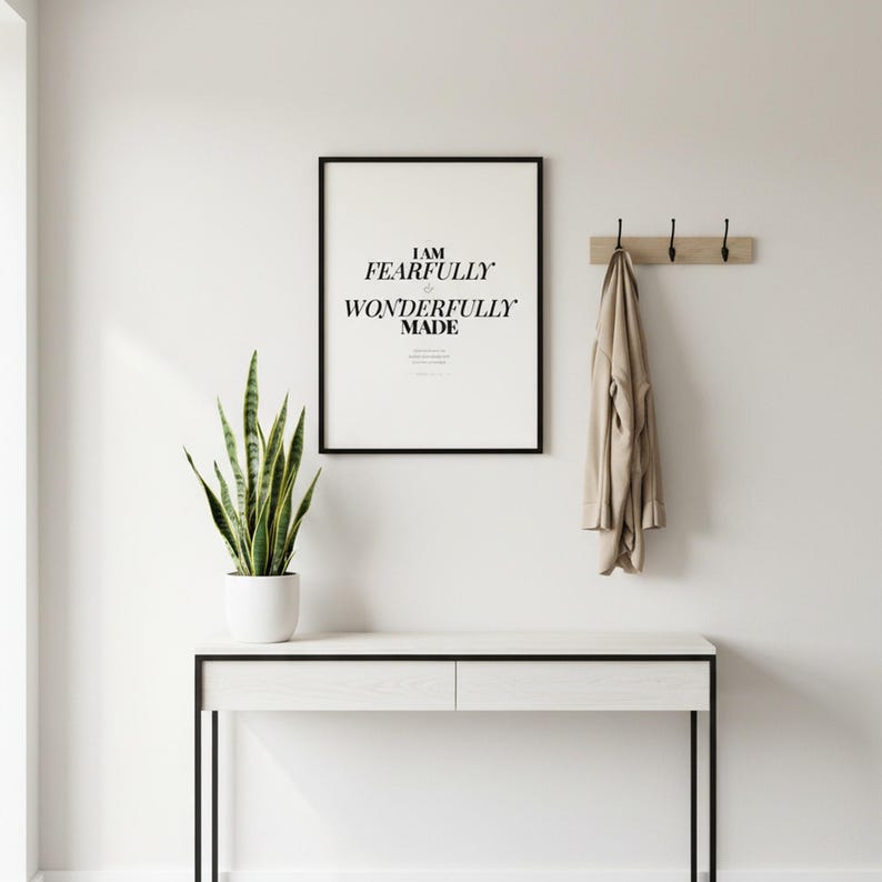 Psalm 139 14 Wall Art Fearfully and Wonderfully Made Scripture Print Nursery, in gentle sage green nursery design with soft botanical watercolor illustration and calming earth tones, displayed in a bright modern entryway next to a coat rack with natural greenery, serving as welcoming faith-filled home decor