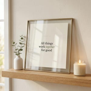 Romans 8:28 Wall Art All Things Work Together for Good Minimalist Scripture Prin — shelf mockup leaning on wood shelf with decorative items. This modern minimalist christian scripture wall art print features beautiful serif typography on warm cream background. Romans 8:28 bible verse digital download printable for home office bedroom living room gallery wall decor. Perfect christian gift idea f...