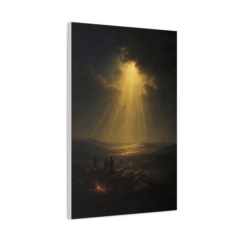 A glowing campfire gathers shepherds and their flock beneath dramatic clouds in this dark vintage oil painting. Heavenly beams fall across the hills above distant Bethlehem, creating a peaceful and reverent nighttime mood. Printed on stretched canvas, the deep blue, brown, and gold Christmas wall art references Luke 2:14. This close product view highlights the printed surface and finished edges.