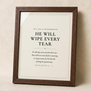 What you get overview showing the design and its four high resolution printable ratios for flexible frame sizes. The He Will Wipe Every Tear artwork presents Revelation 21:4 in minimalist black typography on warm beige. This Revelation 21:4 print suits a sympathy gift, memorial space, prayer room, bedroom, or comforting Christian home as printable digital wall art.