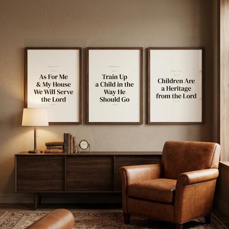 Fathers Day Christian Wall Art Set of 3 Bible Verse Prints Scripture Dad Gift, in warm masculine scripture typography with classic serif design, perfect Father's Day gift for Christian dads, displayed in a beautifully styled modern living room above a warm wooden sideboard with soft natural light creating gentle shadows on the frame, — a meaningful fathers day gift and beautiful Christian home