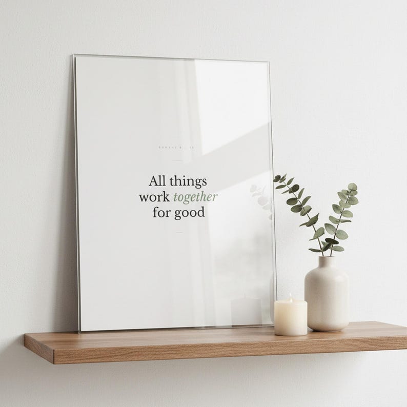 Romans 8:28 Wall Art All Things Work Together for Good Minimalist Scripture Prin — lifestyle mockup in modern room setting with elegant framed print on wall. This modern minimalist christian scripture wall art print features beautiful serif typography on warm cream background. Romans 8:28 bible verse digital download printable for home office bedroom living room gallery wall decor. Perfect chri...