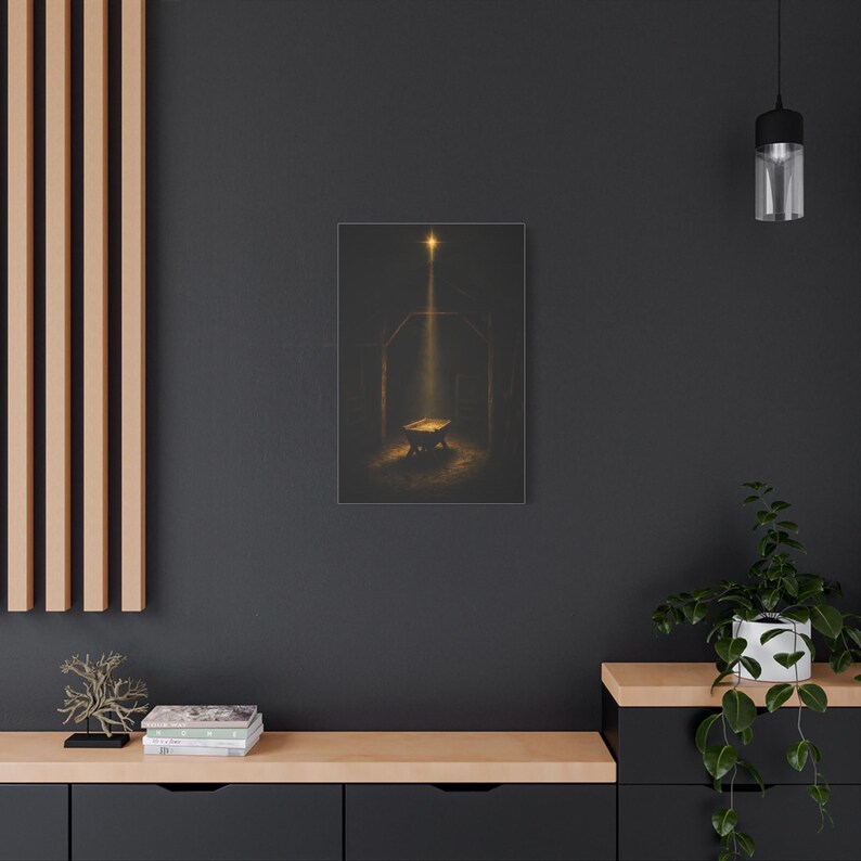 Dark vintage oil painting of an empty wooden manger under the shining Star of Bethlehem in a rustic stable. A warm golden beam illuminates rough timber, straw, and the humble crib, shaping a reverent nighttime scene. Matthew 2:2 nativity wall art in deep brown and gold, printed on stretched canvas. This straight product presentation gives a view of the full composition and canvas proportions.