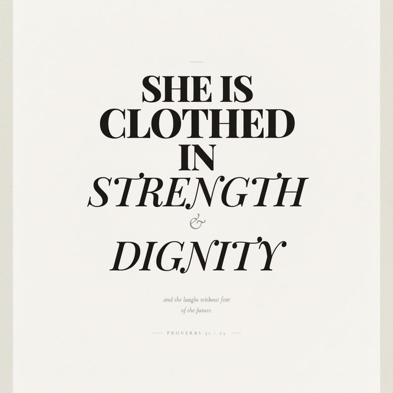 Proverbs 31 25 Wall Art She is Clothed in Strength and Dignity Scripture Print, in elegant Mother's Day design with soft pink watercolor botanical flowers and graceful serif typography, displayed in a bright modern entryway next to a coat rack with natural greenery, serving as welcoming faith-filled home decor