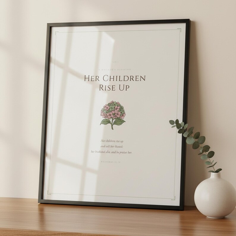 Proverbs 31 28 Mothers Day Print Her Children Rise Up Blessed Christian Wall Art, in gentle sage green nursery design with soft botanical watercolor illustration and calming earth tones, displayed in a bright modern entryway next to a coat rack with natural greenery, serving as welcoming faith-filled home decor