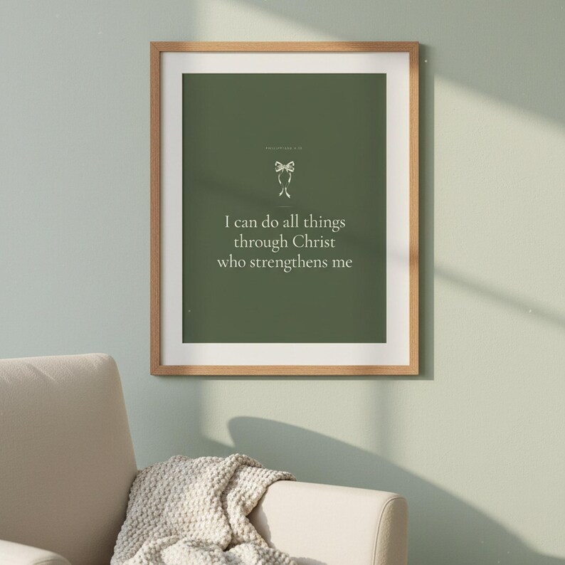 I Can Do All Things Philippians 4 13 Wall Art Sage Coquette Christian Print Dark — front facing framed mockup on clean white wall with shadow. This sage green, coquette bow christian scripture wall art print features beautiful serif typography on warm cream background. Philippians 4 13 bible verse digital download printable for home office bedroom living room gallery wall decor. Perfect christi...