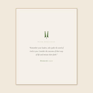 Hebrews 13:7 Remember Your Leaders print framed in light oak above a dark leather armchair, cream linen throw and open Bible on side table, warm afternoon light, refined christian home office decor, pastor appreciation wall art instant digital download from TheFramedVerse Etsy shop, pastor church leader gift