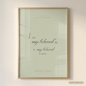 Song of Solomon 6:3 'I Am My Beloved's, and My Beloved Is Mine' coquette sage Christian wedding scripture print in solid walnut frame, frontal studio shot on cream backdrop with soft top-left key light, glass reflection, e-commerce hero photograph, bridal shower gift digital download by TheFramedVerse