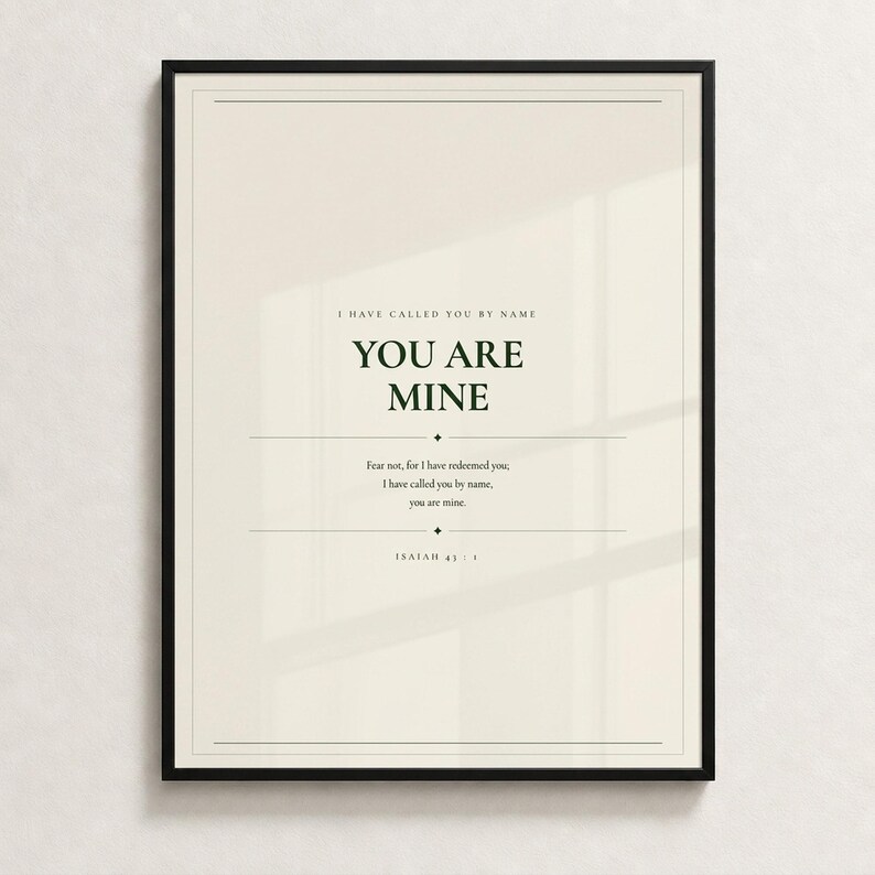 You Are Mine Isaiah 43:1 scripture print minimalist christian baptism gift baby dedication nursery wall art dark forest green typography on warm cream background, front-facing product shot thin black frame cream textured wall soft diffused natural light clean, digital download printable wall art instant download