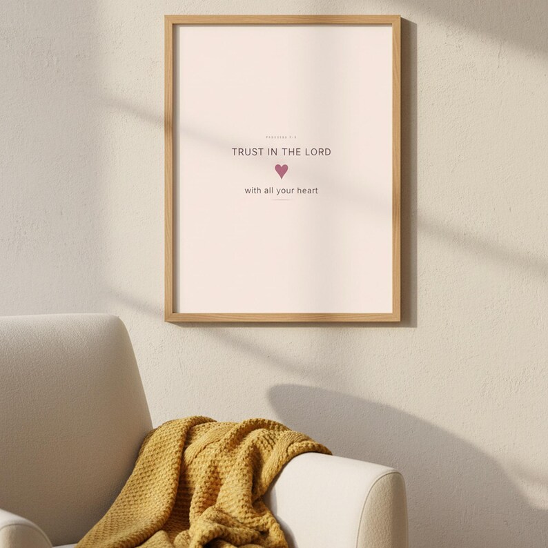 Trust in the Lord With All Your Heart Proverbs 3:5 Wall Art Pink Blush Coquette  — botanical glass frame mockup with natural light and greenery. This coquette bow, pink blush christian scripture wall art print features beautiful serif typography on warm cream background. Proverbs 3:5 bible verse digital download printable for home office bedroom living room gallery wall decor. Perfect christian...