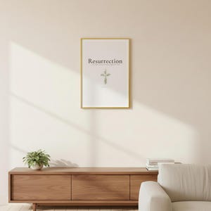 Resurrection Christian Scripture Art, Floral Cross Spring Decor, in beautiful floral cross composed of spring roses, greenery and wildflowers, displayed in a bright modern entryway next to a coat rack with natural greenery, serving as welcoming faith-filled home decor. Instant digital download printable wall art in multiple sizes for easy home printing