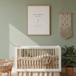 Isaiah 43 1 I Have Called You by Name nursery wall art in oak frame on sage green wall above white crib with macrame and rattan decor. Watercolor lavender sprig botanical illustration. Gender neutral Christian nursery printable digital download for baptism baby shower christening gift.