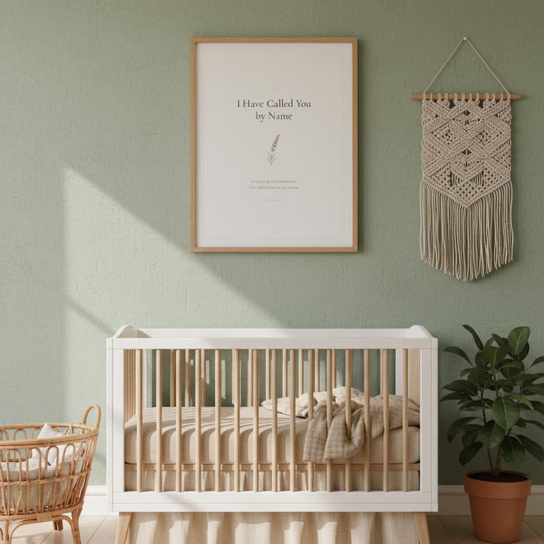 Isaiah 43 1 I Have Called You by Name nursery wall art in oak frame on sage green wall above white crib with macrame and rattan decor. Watercolor lavender sprig botanical illustration. Gender neutral Christian nursery printable digital download for baptism baby shower christening gift.