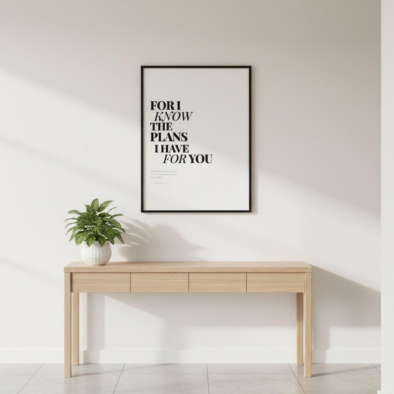 Jeremiah 29:11 Wall Art For I Know the Plans I Have for You Modern Christian, in contemporary bold serif typography in black on clean white background, styled on a wooden floating shelf next to a ceramic vase with dried eucalyptus, creating a warm and inviting Christian home decor vignette
