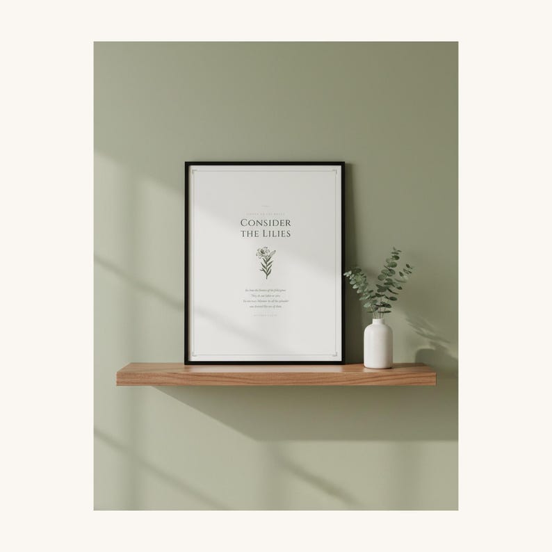 Consider the Lilies Matthew 6 28 framed Scripture Print on shelf in christian home, sage green aesthetic decor, sermon on the mount botanical bible verse poster, aesthetic christian floral scripture printable