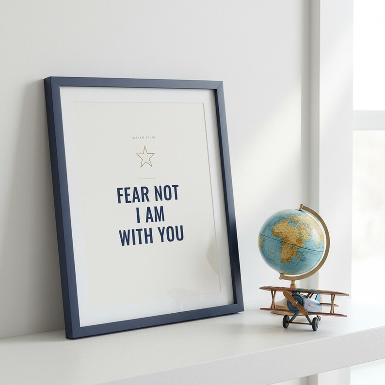 Fear Not I Am With You Isaiah 41:10 Wall Art Christian Boys Room Print Scripture — lifestyle mockup in modern room setting with elegant framed print on wall. This elegant christian scripture wall art print features beautiful serif typography on warm cream background. Isaiah 41:10 bible verse digital download printable for home office bedroom living room gallery wall decor. Perfect christian gif...