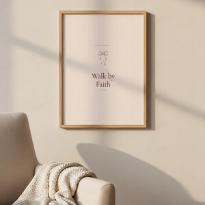 Walk by Faith Not by Sight 2 Corinthians 5:7 Wall Art Pink Blush Coquette Christ — botanical glass frame mockup with natural light and greenery. This coquette bow, pink blush christian scripture wall art print features beautiful serif typography on warm cream background. Sight 2 bible verse digital download printable for home office bedroom living room gallery wall decor. Perfect christian gift...