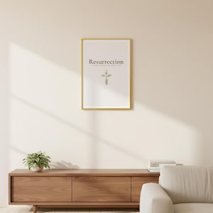 Resurrection Christian Scripture Art, Floral Cross Spring Decor, in beautiful floral cross composed of spring roses, greenery and wildflowers, displayed in a beautifully styled modern living room above a warm wooden sideboard with soft natural light creating gentle shadows on the frame, — a meaningful confirmation gift and beautiful Christian home decor