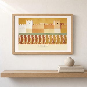 Shelf mockup of The Walls of Jericho in a light oak frame resting on a pale wood surface beside stacked neutral books and a rounded ceramic vase. The framed print shows a fortified ochre city above a passing line of faceless horn bearers. Cream matting, soft wall texture, and natural light present the horizontal Bible artwork at an easy domestic scale.