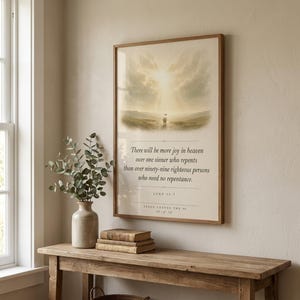 Jesus Leaves the 99 minimalist scripture set of three in natural oak frames grouped above a cream boucle sofa, linen throw draped over armrest, side table with ceramic mug and small potted olive branch, warm natural morning light, editorial christian farmhouse living room wall art, lost sheep Luke 15 digital download from TheFramedVerse Etsy