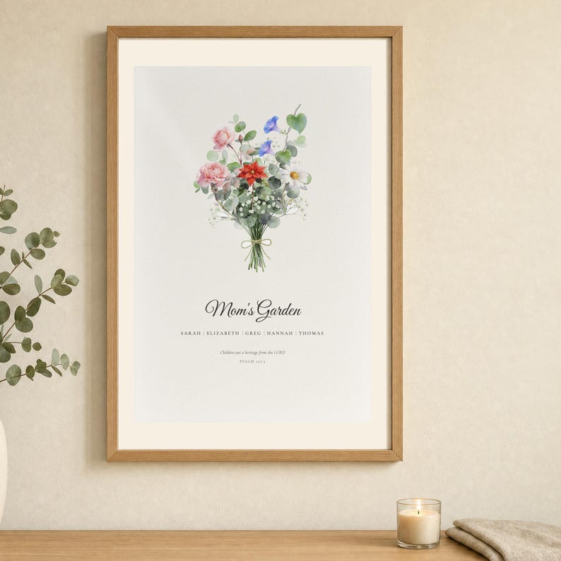 Lifestyle room mockup showing a Christian family birth flower bouquet in a light wood frame above a neutral console. The watercolor print combines individual birth month flowers, names, a custom title and Psalm 127:3, Children are a heritage from the LORD. Soft daylight and simple decor present it as a meaningful Christmas gift for mom or grandma.