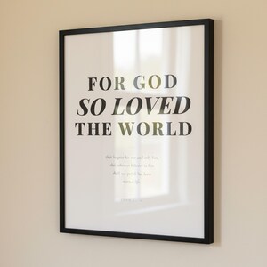 John 3 16 Wall Art For God So Loved the World Scripture Print Modern Christian, — "For God so loved the world that He gave His one and only Son", in contemporary bold serif typography in black on clean white background, presented as an elegant flat lay on white marble with a fountain pen and eucalyptus sprig, showing the complete print design in full detail