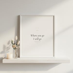 Where You Go I Will Go Ruth 1:16 Wall Art Christian Wedding Print Scripture Deco — front facing framed mockup on clean white wall with shadow. This wedding christian scripture wall art print features beautiful serif typography on warm cream background. Ruth 1:16 bible verse digital download printable for home office bedroom living room gallery wall decor. Perfect christian gift idea from TheFra...