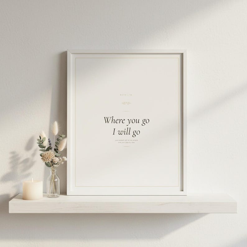 Where You Go I Will Go Ruth 1:16 Wall Art Christian Wedding Print Scripture Deco — front facing framed mockup on clean white wall with shadow. This wedding christian scripture wall art print features beautiful serif typography on warm cream background. Ruth 1:16 bible verse digital download printable for home office bedroom living room gallery wall decor. Perfect christian gift idea from TheFra...