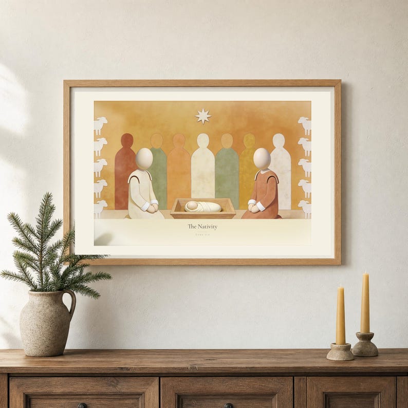 Room mockup of The Nativity from the Christmas story set, framed in light oak on a warm neutral wall. The artwork shows the wrapped child in a low manger between two kneeling figures beneath a single star, with sheep along both edges. Wide cream mat and restrained fresco palette suit a calm living room or advent display.