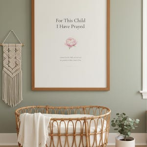 For This Child I Have Prayed 1 Samuel 1 27 Nursery Wall Art Bible Verse Print, — "For this child I have prayed, and the Lord has granted me what I asked of Him", in gentle sage green nursery design with soft botanical watercolor illustration, calming earth tones and tender serif typography, showcased in an elegantly designed nursery with warm wood baby furniture and soft botanical touches