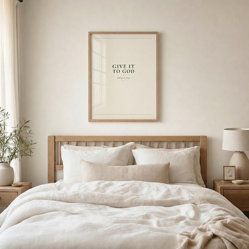 Give It To God framed print above bed with white linen. Oak frame, farmhouse bedroom. Christian bedroom wall art digital download by TheFramedVerse.