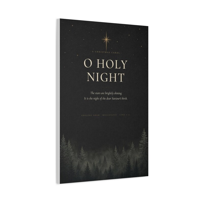 Shadowy evergreens border elegant cream O Holy Night serif lettering on textured charcoal paper, surrounded by scattered golden stars. This dark vintage black, cream, and gold design draws on the beloved Christmas carol and Luke 2:11. The dramatic typography artwork is printed on stretched canvas. This close product view highlights the printed surface and finished edges.