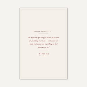 1 Peter 5:2 Be Shepherds scripture print in thin black frame on white marble surface, single olive branch casting soft shadow, two unlit votive candles, warm beige textured wall, bright morning light with clean glass reflection, editorial still life pastor appreciation christian print from TheFramedVerse