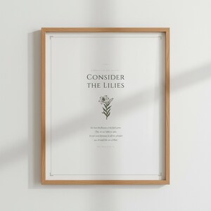 Consider the Lilies Matthew 6 28 Scripture Print in oak wood frame with vase, sage green christian aesthetic decor, sermon on the mount bible verse wall art, aesthetic christian floral scripture printable