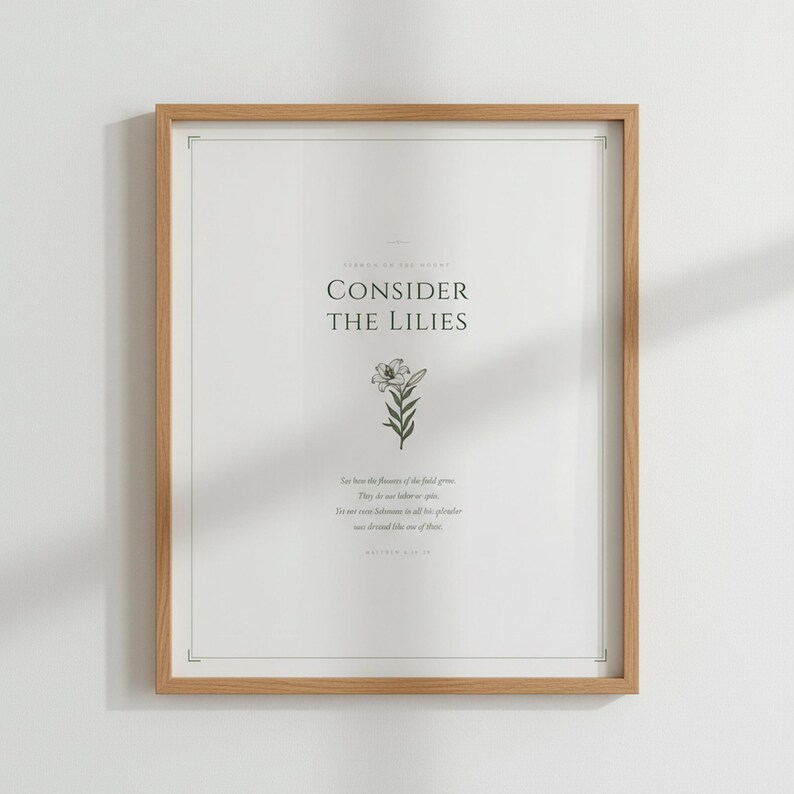 Consider the Lilies Matthew 6 28 Scripture Print in oak wood frame with vase, sage green christian aesthetic decor, sermon on the mount bible verse wall art, aesthetic christian floral scripture printable