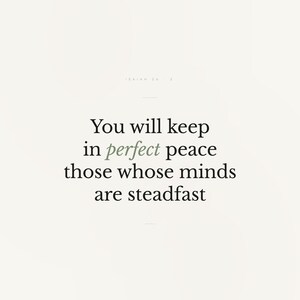 Isaiah 26:3 Wall Art You Will Keep in Perfect Peace Minimalist Scripture Print B — hero framed product shot with glass reflection and premium frame. This modern minimalist christian scripture wall art print features beautiful serif typography on warm cream background. Isaiah 26:3 bible verse digital download printable for home office bedroom living room gallery wall decor. Perfect christian gif...