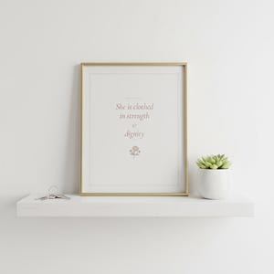 She Is Clothed in Strength and Dignity Proverbs 31 25 Wall Art Coquette Christia — what you get size overview showing all available print dimensions. This coquette bow, botanical, pink blush christian scripture wall art print features beautiful serif typography on warm cream background. Proverbs 31 25 bible verse digital download printable for home office bedroom living room gallery wall decor....