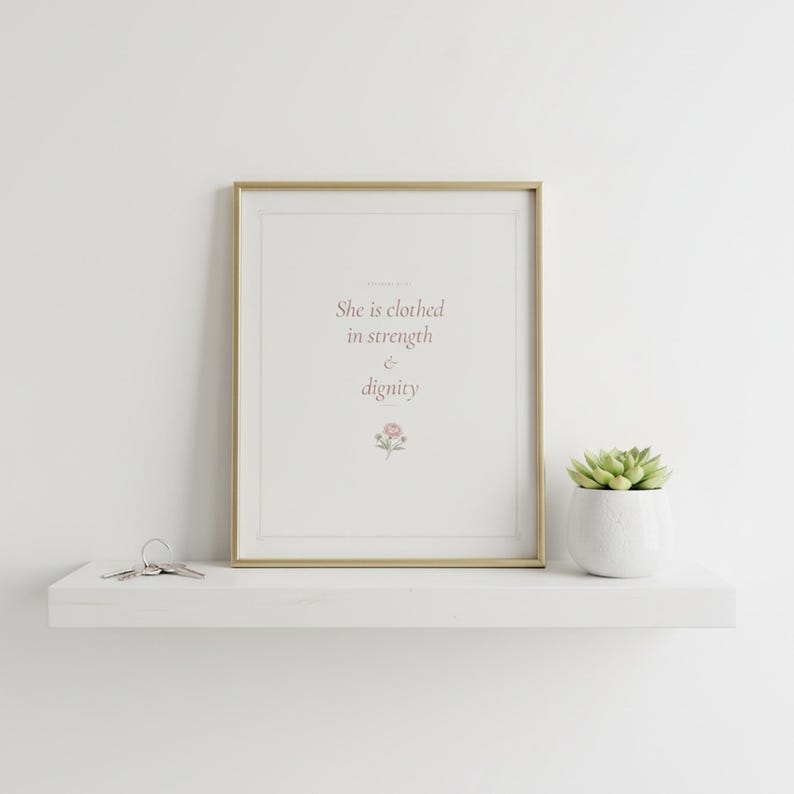 She Is Clothed in Strength and Dignity Proverbs 31 25 Wall Art Coquette Christia — what you get size overview showing all available print dimensions. This coquette bow, botanical, pink blush christian scripture wall art print features beautiful serif typography on warm cream background. Proverbs 31 25 bible verse digital download printable for home office bedroom living room gallery wall decor....