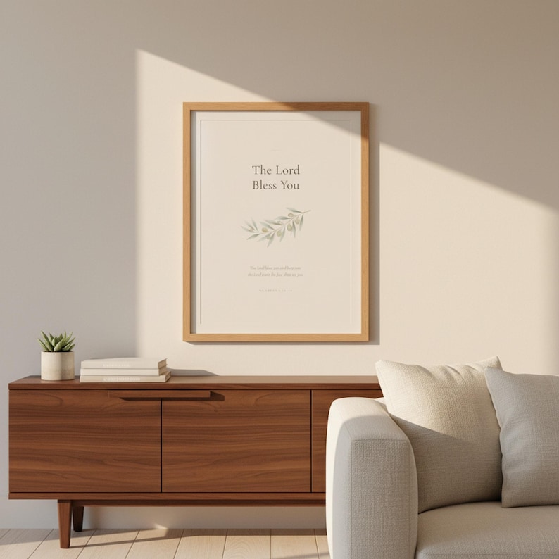 The Lord Bless You Numbers 6 24 26 Nursery Bible Verse Print Christian Wall Art, — "The Lord bless you and keep you; the Lord make His face shine on you", in gentle sage green nursery design with soft botanical watercolor illustration and calming earth tones, hanging in a serene sage green nursery above a rattan bassinet with a cozy white blanket, macrame wall hanging