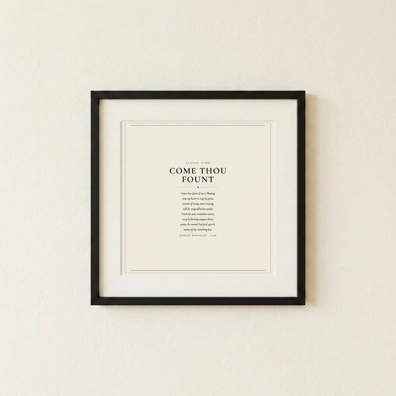 Come Thou Fount of Every Blessing hymn lyric scripture art print in thin black frame on warm cream textured wall, front-facing clean product photo, dark forest green minimalist typography on cream background, christian hymn wall art song lyric art print baptism gift confirmation gift first communion